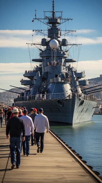 Premium Photo | Crew members working on the deck of a battleship