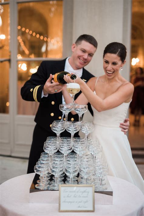 Bride And Groom Pouring Champagne Tower