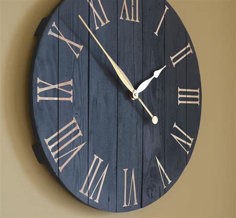 a wooden clock with roman numerals on the face