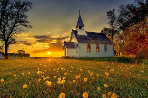 Download A Church With A Field Of Dandelions In The Background