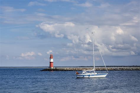 Baltic Sea in North East Germany with Lighthouse and Boat Wallpaper ...