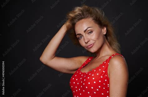 Attractive Provocative Sexy Blonde Woman In Red Swimsuit Holding Her Hand On Head And Touching
