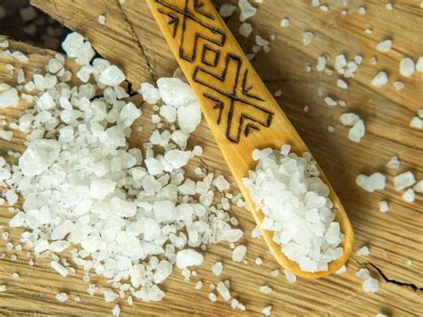 Premium Photo Sea Salt In A Wooden Spoon On A Wooden Background