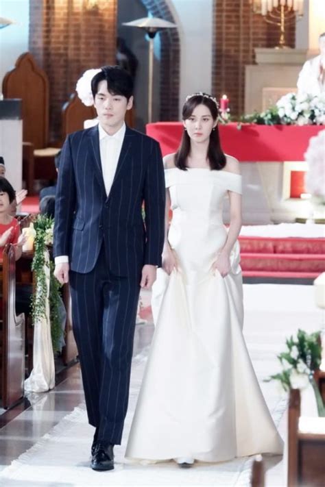 Seohyun And Kim Jung Hyun Are A Somber Bride And Groom For Their