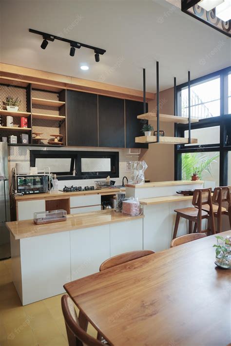 Premium Photo | Wooden modern kitchen interior with island table