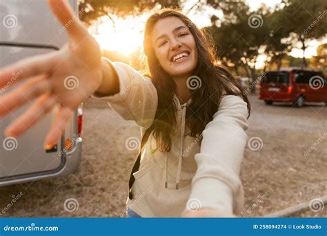 Nice Young Caucasian Woman Stretches Her Hand To Camera Relaxing