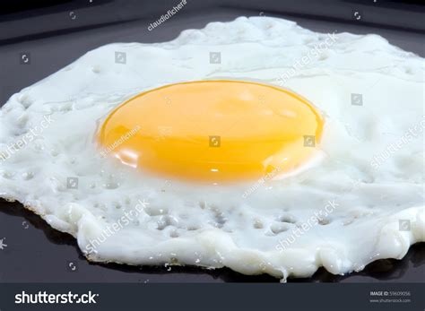 Fried Egg In Black Dish Stock Photo 59609056 : Shutterstock