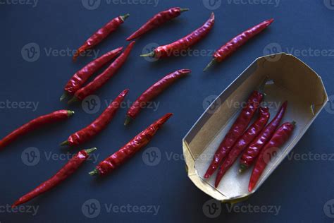 Pods Of Red Hot Pepper On A Black Background In A Container Burning Spices Pepper For Dressing