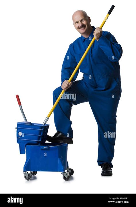 Portrait Of A Male Janitor Holding A Mop Stock Photo Alamy