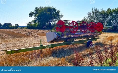 Harvester Machine Harvesting Fresh Crops on a Farm Field during a Sunny ...