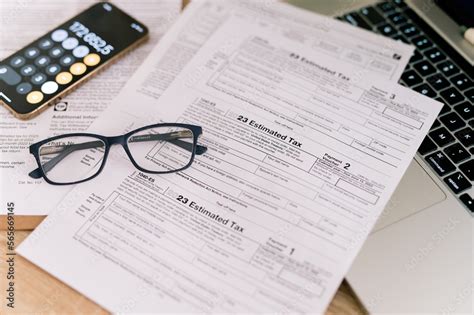 tax forms 2023 with glasses on the office table Stock Photo | Adobe Stock