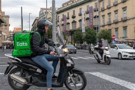 Uber Eats, Boy with Scooter, Delivers Food To Home, with the Typical Green Backpack Editorial ...