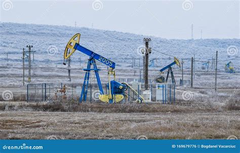 Oil Rig Derrick In Oilfield Against The Bright Blue Sky. Drilling Rig In Oil Field For Drilled ...