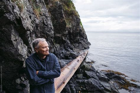 Mature Man Exploring The Beach On His Own By Stocksy Contributor Rob And Julia Campbell