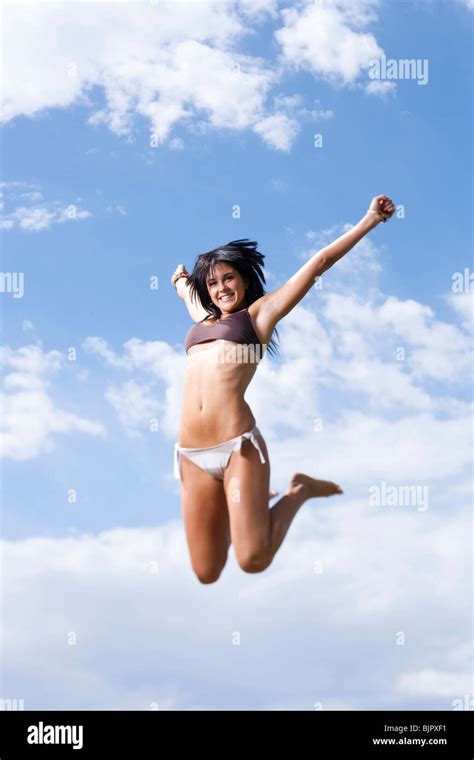 Woman In Bikini Jumping Stock Photo Alamy