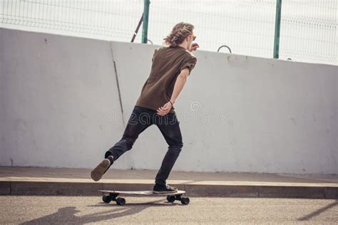 Boy Riding Longboard On Boardwalk Warm Summer Time Stock Image Image