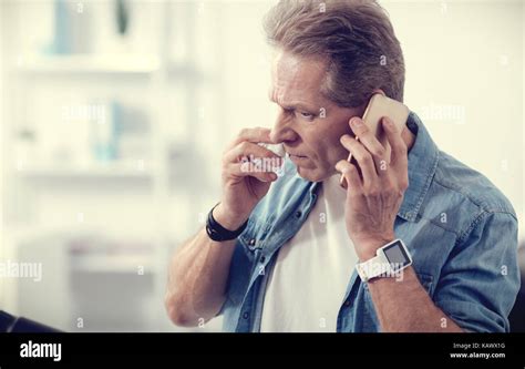 Serious Handsome Man Talking On The Phone Stock Photo Alamy