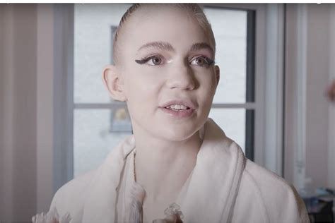 Did Grimes Remove Part of Her Eyeball in an Experimental Surgery?