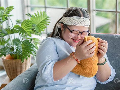 Portrait Close Up Shot Of Asian Young Happy Chubby Down Syndrome