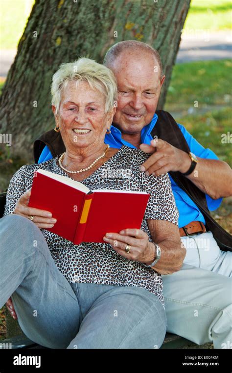 Older Senior Citizens Married Couple Are In Love Read Book Hi Res Stock