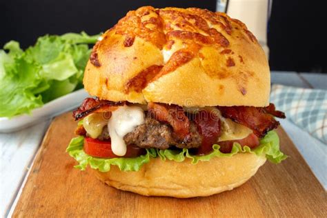 Bacon Cheese Burger With Tomato Lettuce And A Drop Of Mayonnaise