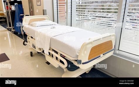 Hospital Setting Operating Room Hallway Hospital Bed And Machines Stock