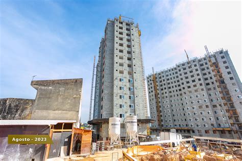 An Apartment Building Under Construction Next To Other Buildings