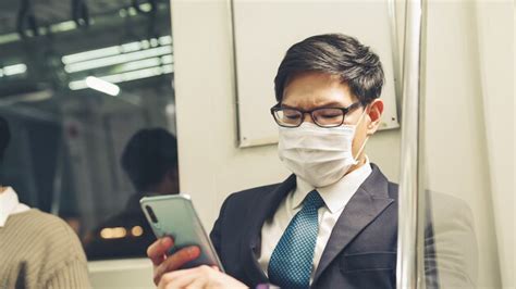 Premium Photo Young Man Wearing Face Mask Travels On Crowded Subway Train