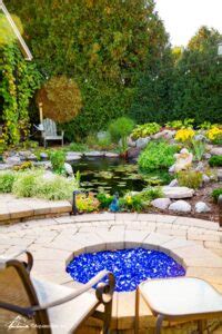 See How A Koi Pond Creates The Ultimate Backyard Masterpiece Pond And