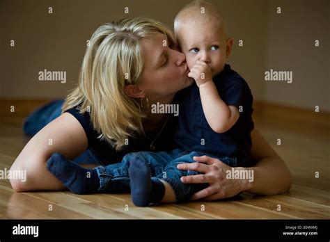 Mother Kissing Her Son Stock Photo Alamy