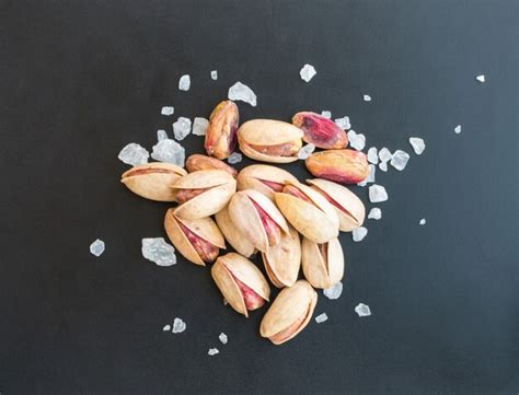 Premium Photo Heap Of Inshell Pistachios And Peeled Pistachios With