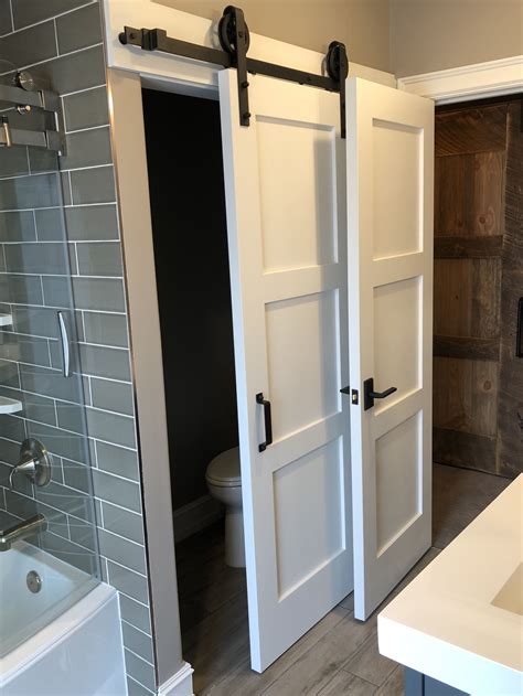 Small Bathroom with Toilet Behind Sliding Door