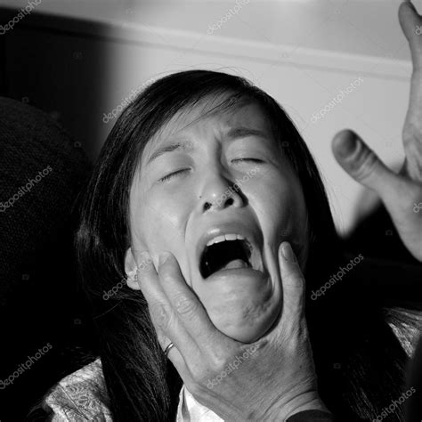 Sad asian woman crying desperate Stock Photo by ©fedemarsicano 59349451