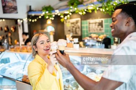 Black Couple Eating Ice Cream Photos And Premium High Res Pictures