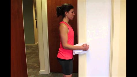 Standing Isometric Shoulder Internal Rotation With Towel Roll At