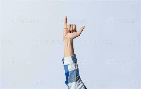 Hand gesturing the letter Y in sign language on an isolated background ...