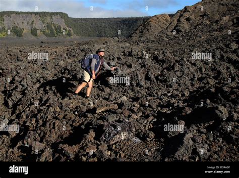 Kilauea iki crater hikers on trail near a`a lava Volcanos National Park ...