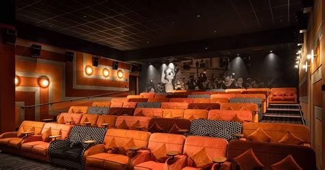 luxury everyman cinema opens  surrey town  velvet sofas
