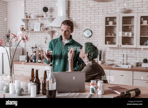 Blonde Haired Husband Taking Wine Away From His Addicted Wife Stock Photo Alamy