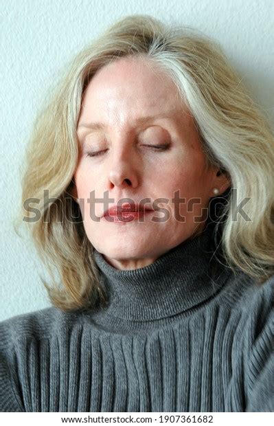 Mature Female Blond Beauty Expressions Indoors Stock Photo