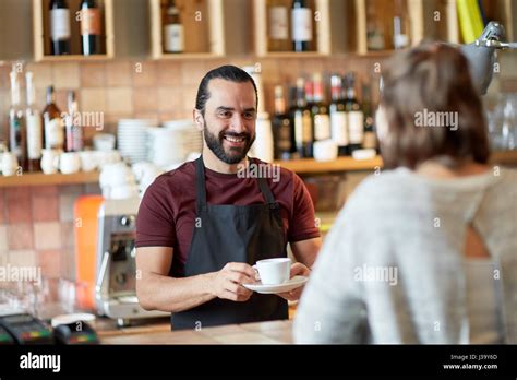 Man Or Waiter Serving Customer In Coffee Shop Stock Photo Alamy