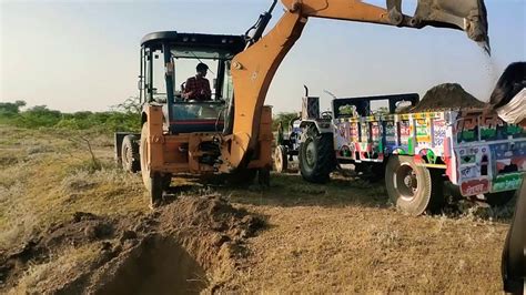 Jcb Backhoe Machine Making Drain And Loading Soil In Tractor Jcb