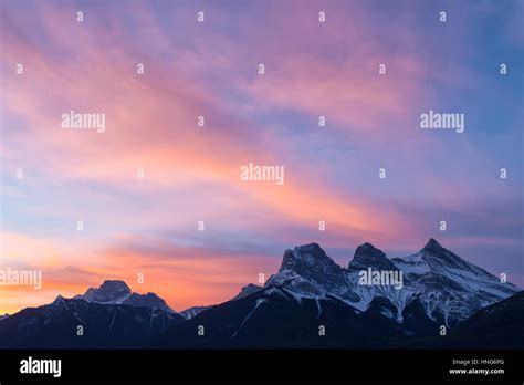 Sunrise On The Three Sisters Mountains In Canmore Alberta Canada