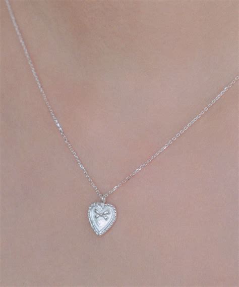 MUSINSA POSTLUDE SILVER HEART MINI RIBBON PENDANT N