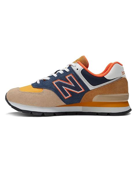 New Balance 574 Rugged Logo Suede Running Sneakers In Blue For Men Lyst