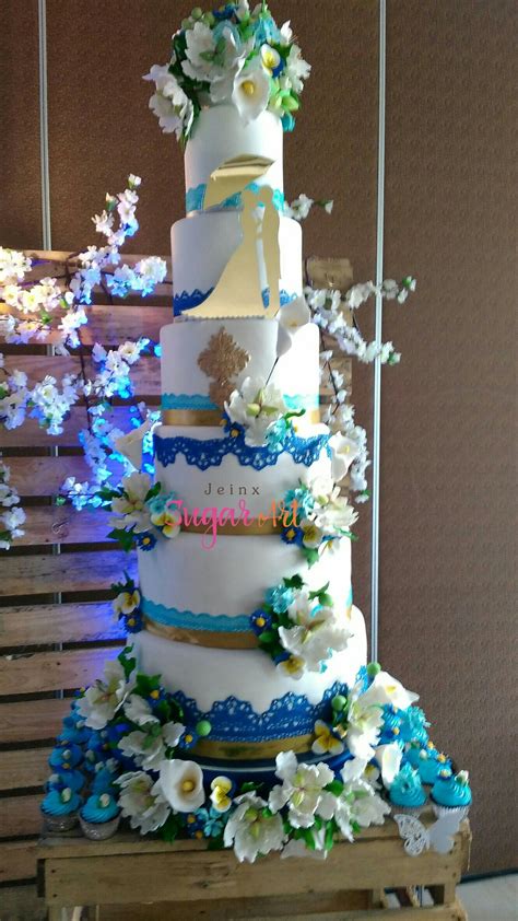 Royal Blue and Gold Wedding Cake with Edible Flowers