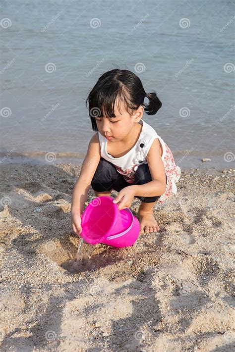 Asian Chinese Little Girl Playing Sand At Beach Stock Photo Image Of