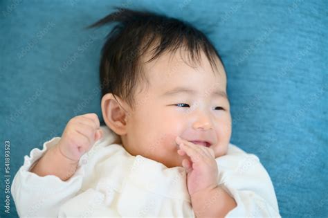 Smiling baby with a very cute smile. Stock Photo | Adobe Stock