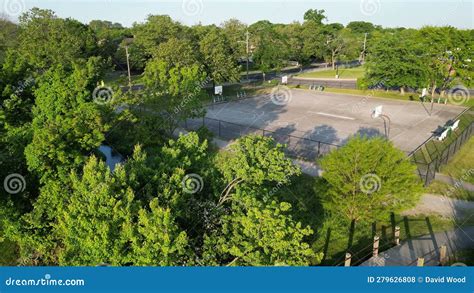 Drove View Of A Small Wooden Bridge In A Small Park Ending Over