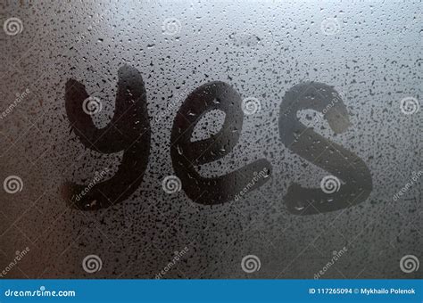 The English Word Yes Is Written With A Finger On The Surface Of The